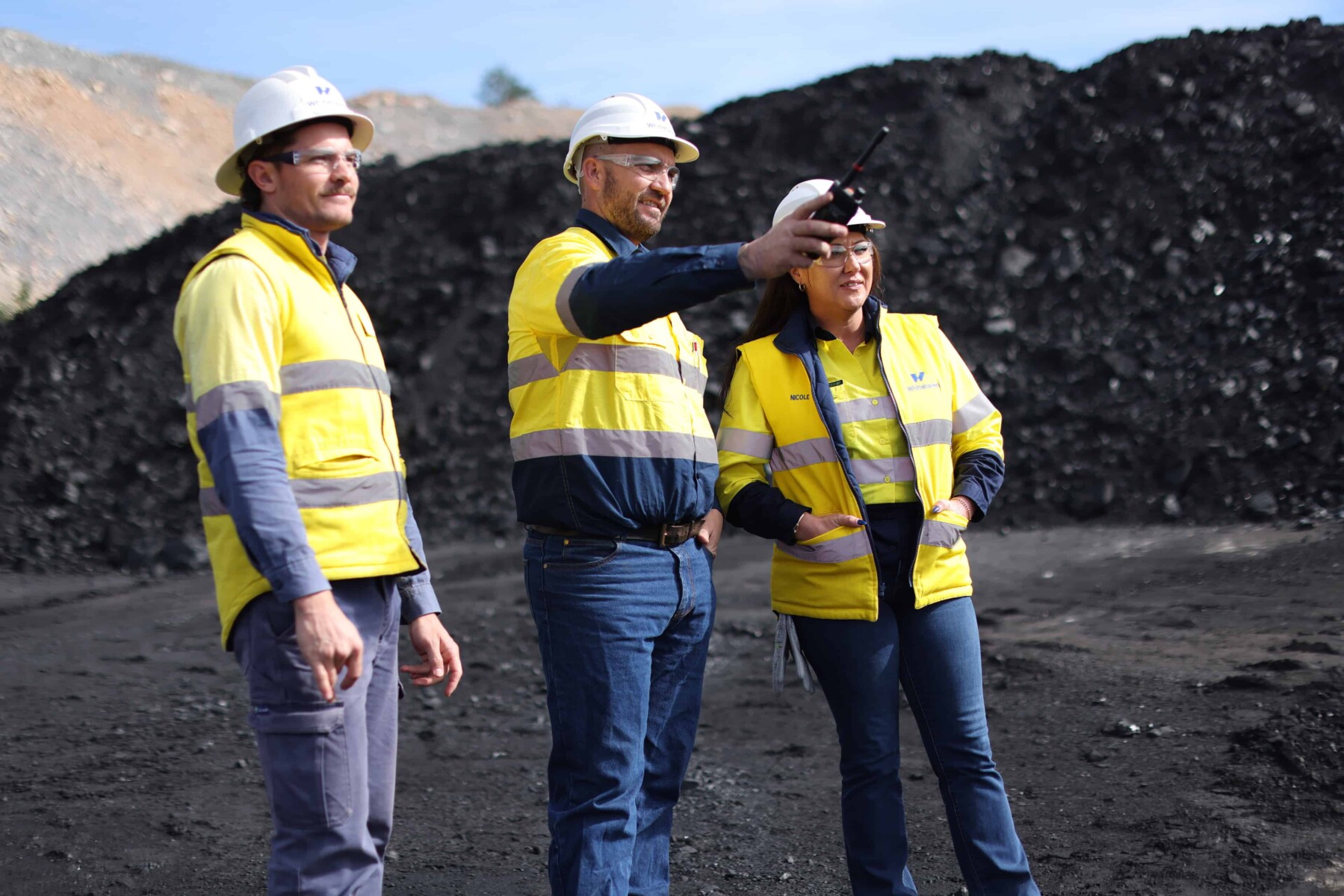 3 in front of coal stockpile